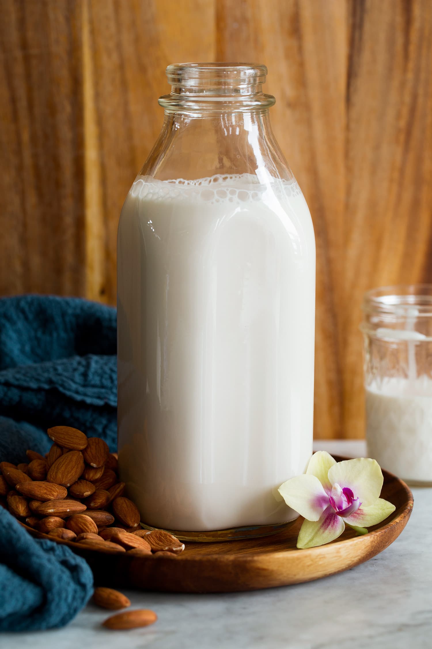 Homemade almond milk in a large glass milk pitcher.