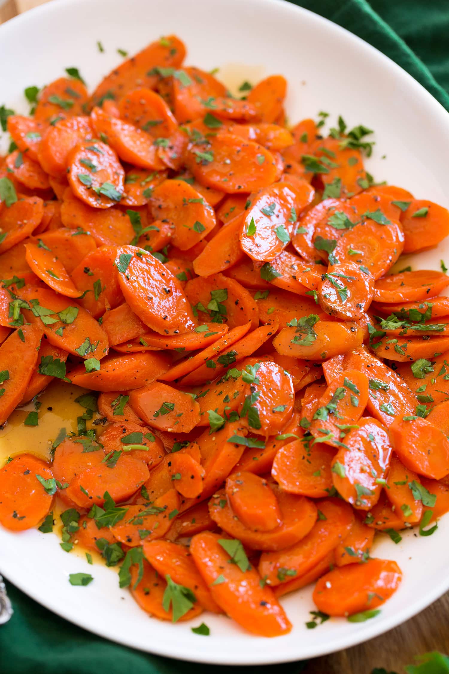 Close up photo of glazed carrots with brown sugar and butter.